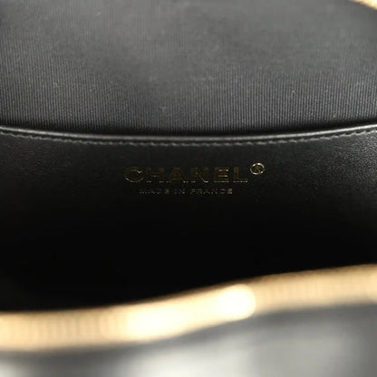 Chanel interior brand label on black fabric lining inside heart bag