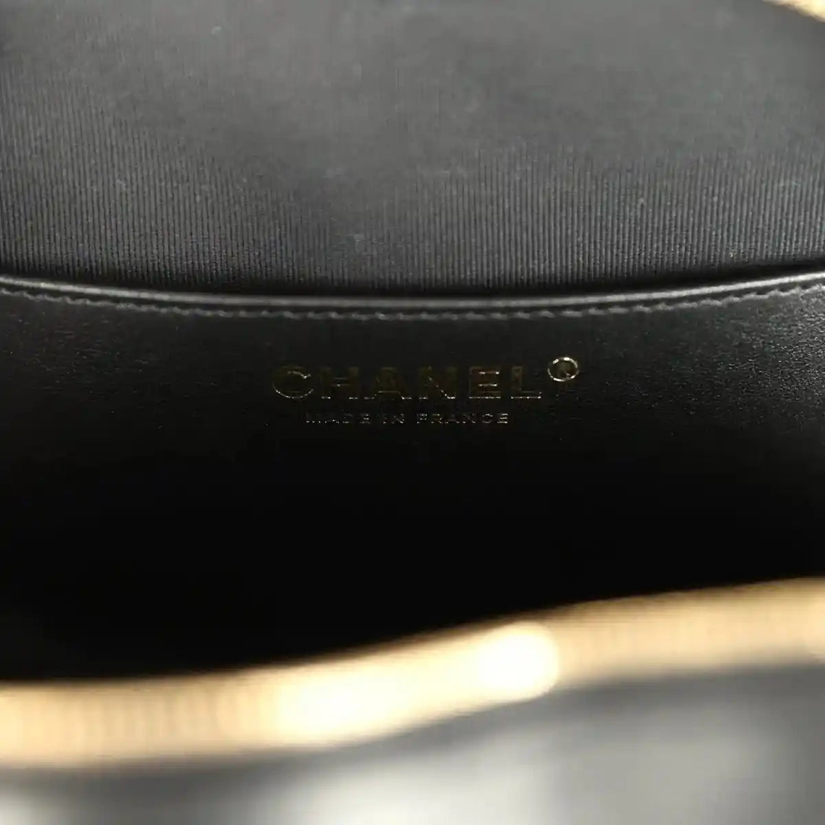 Chanel interior brand label on black fabric lining inside heart bag