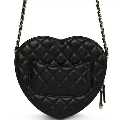 Chanel heart bag back view with quilted lambskin, gold zipper tassel, black
