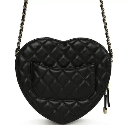 Chanel heart bag back view with quilted lambskin, gold zipper tassel, black