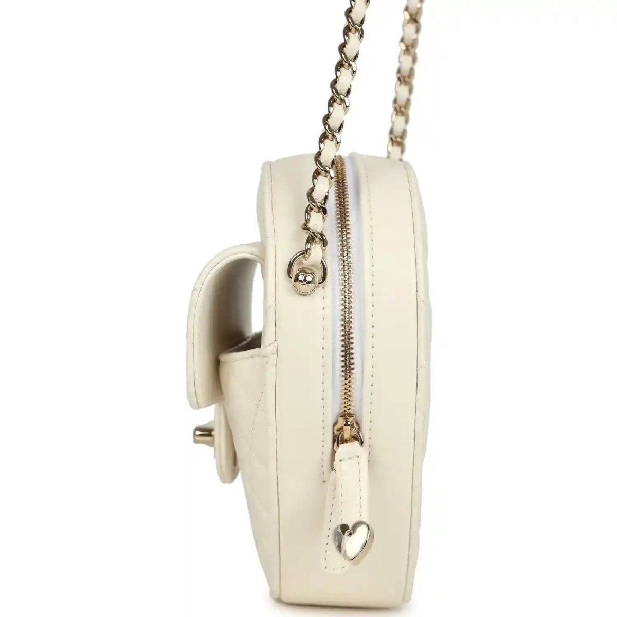 Heart-shaped white shoulder bag back view with gold hardware, zipper, and small heart charm