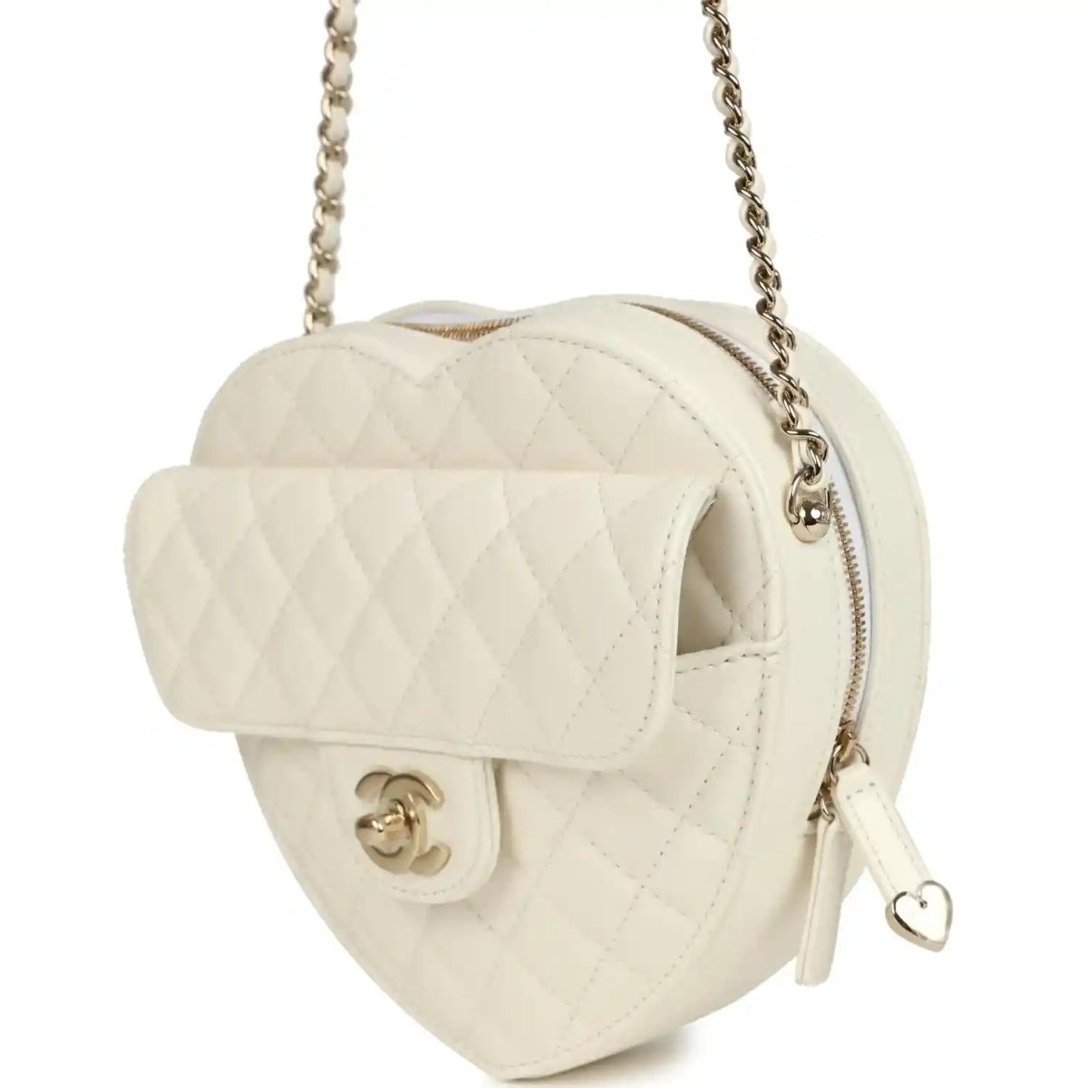 White quilted heart bag with flap open, gold-tone CC clasp, chain strap, and heart pull tab