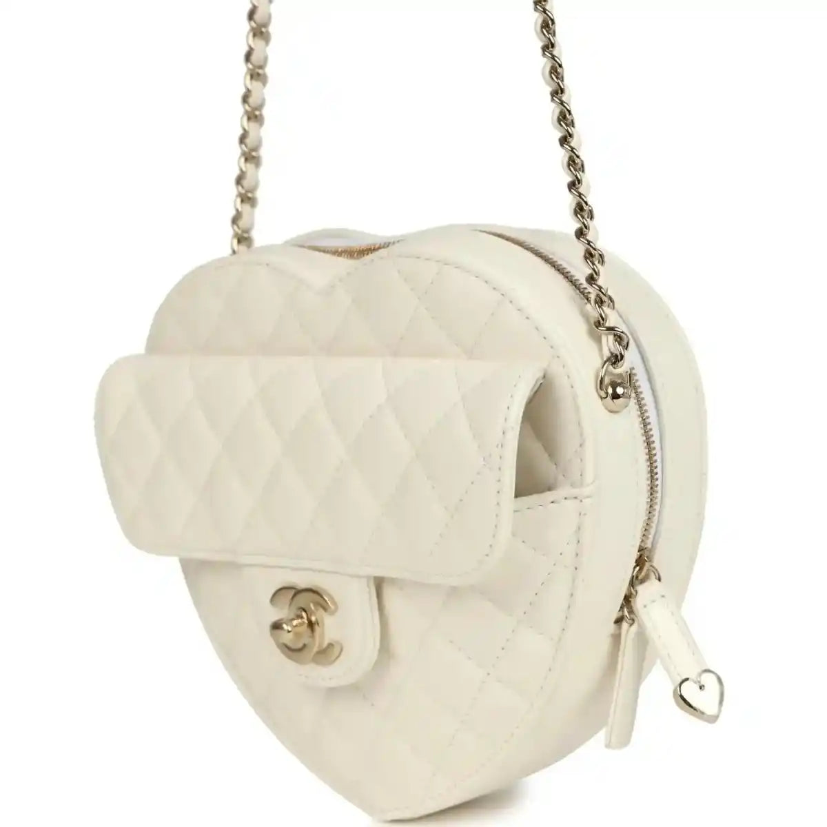 White quilted heart bag with flap open, gold-tone CC clasp, chain strap, and heart pull tab
