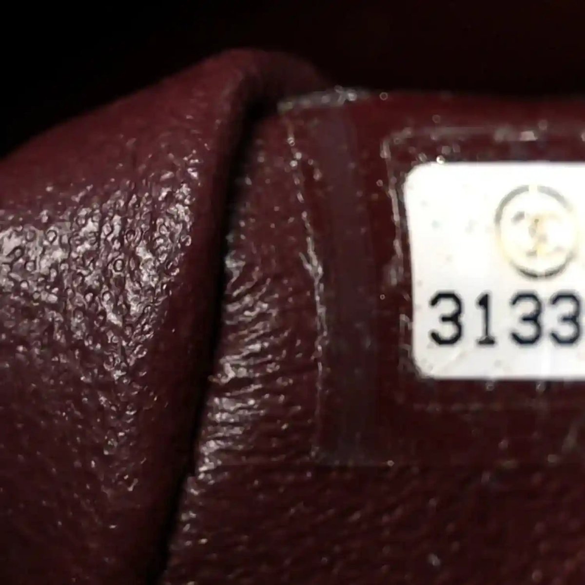 Chanel serial number label on dark maroon leather lining inside bag
