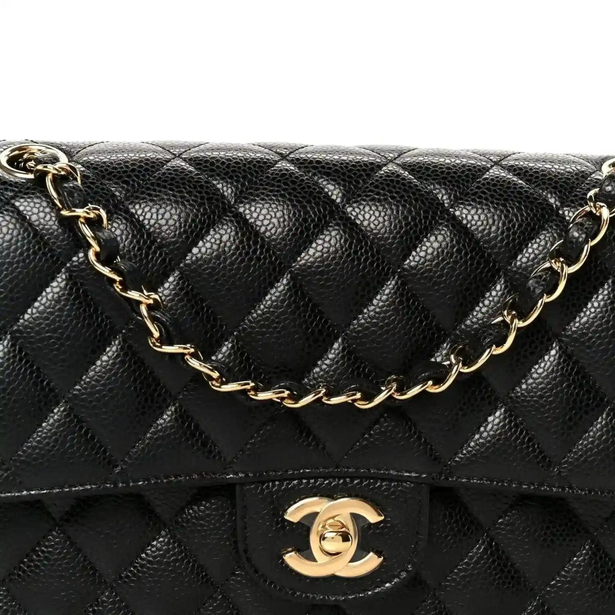 Chanel medium double flap bag front view with quilted caviar texture and gold logo