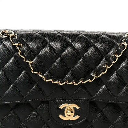 Chanel medium double flap bag front view with quilted caviar texture and gold logo