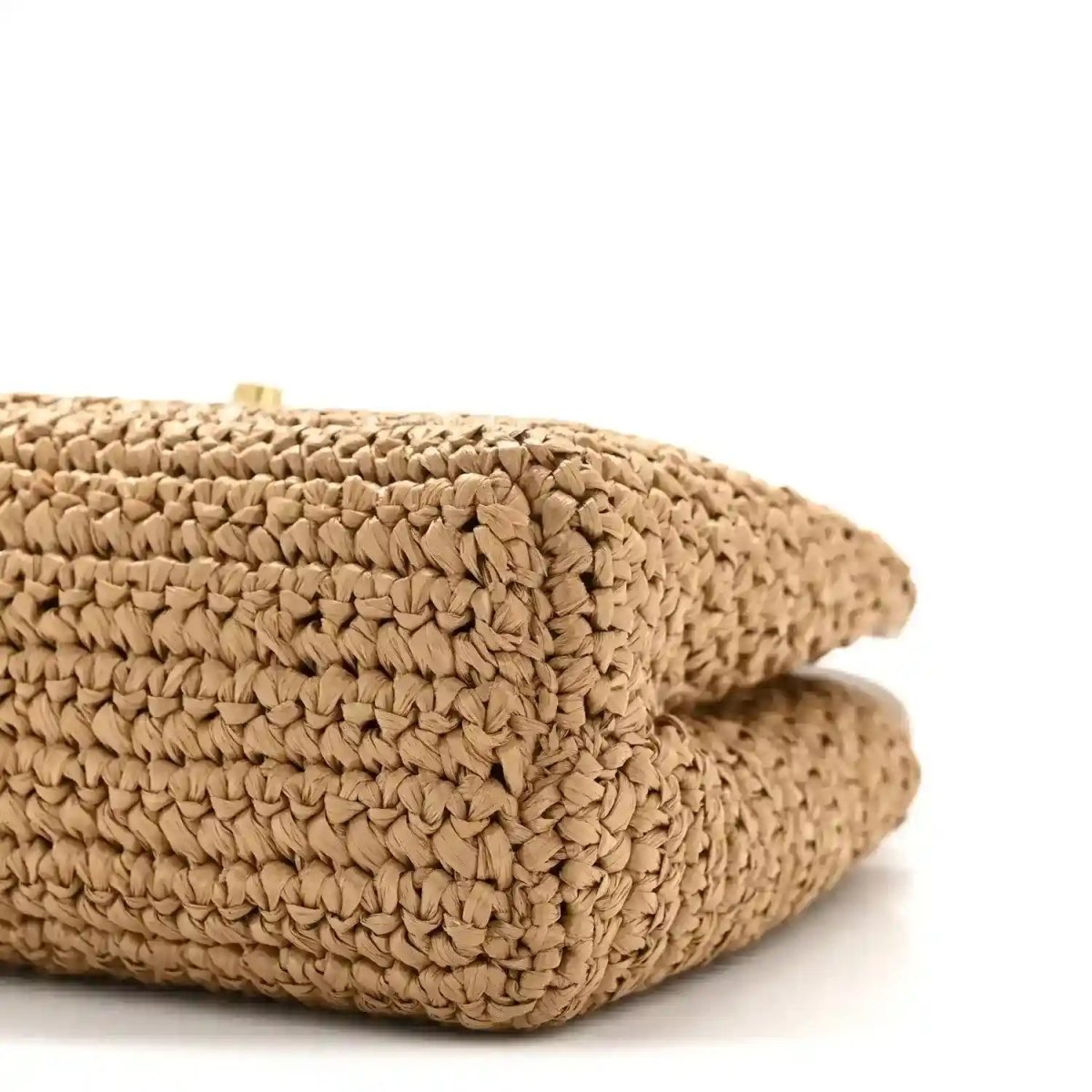 Dark beige braided raffia nano bag rounded side profile
