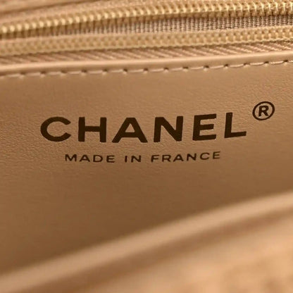 Beige leather interior panel with Chanel logo and Made in France text