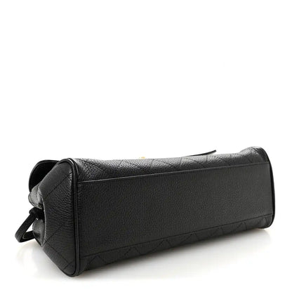 Black grained calfskin small shopping bag with side zipper pull and structured end panel