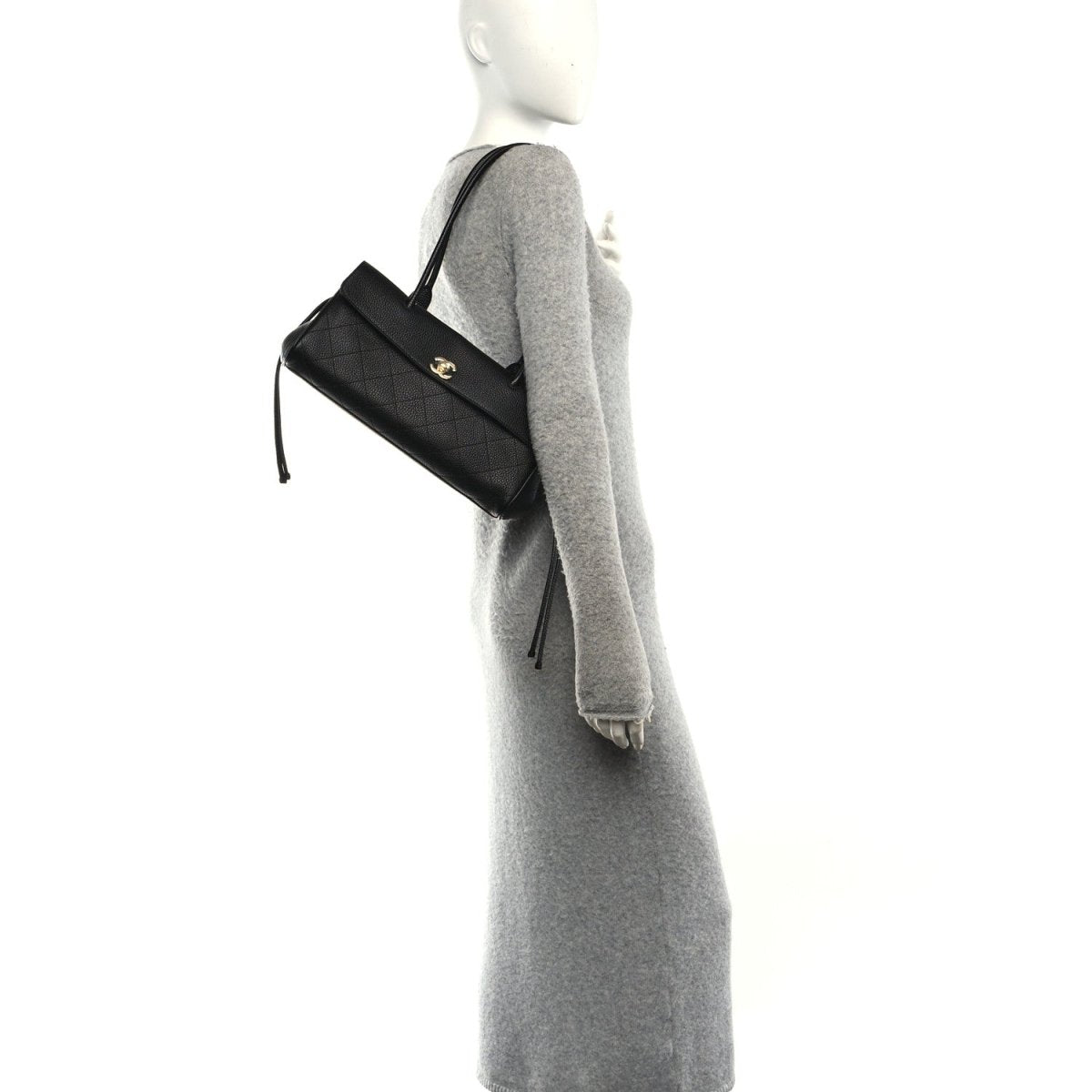 CHANEL small black grained calfskin shopping bag, side view with shoulder strap detail
