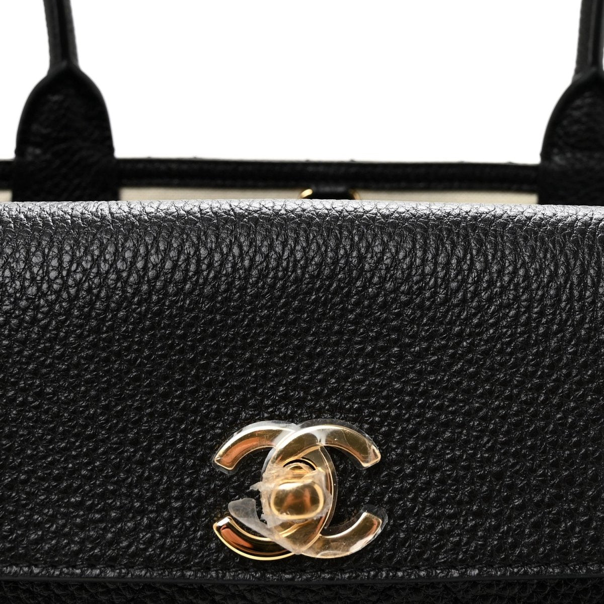 Black grained leather front panel with gold Chanel CC clasp