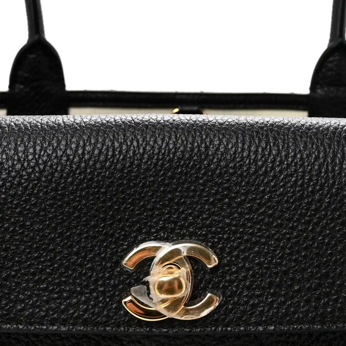 Black grained leather front panel with gold Chanel CC clasp