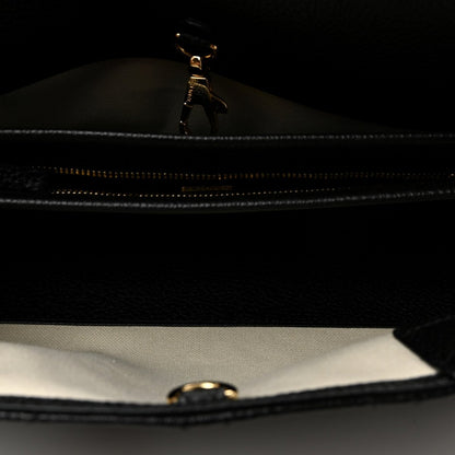 Black zipper close-up inside small shopping bag with metal pull tab