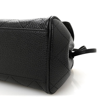 Black grained calfskin small shopping bag with side seam stitching and small strap loop