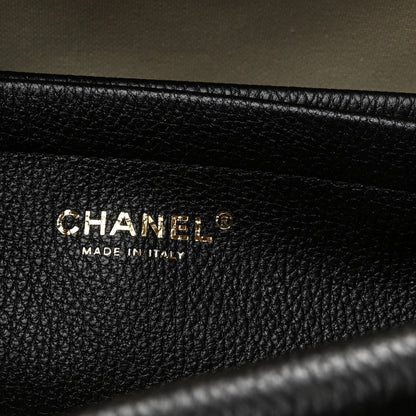 Black grained leather interior label reading CHANEL and MADE IN ITALY