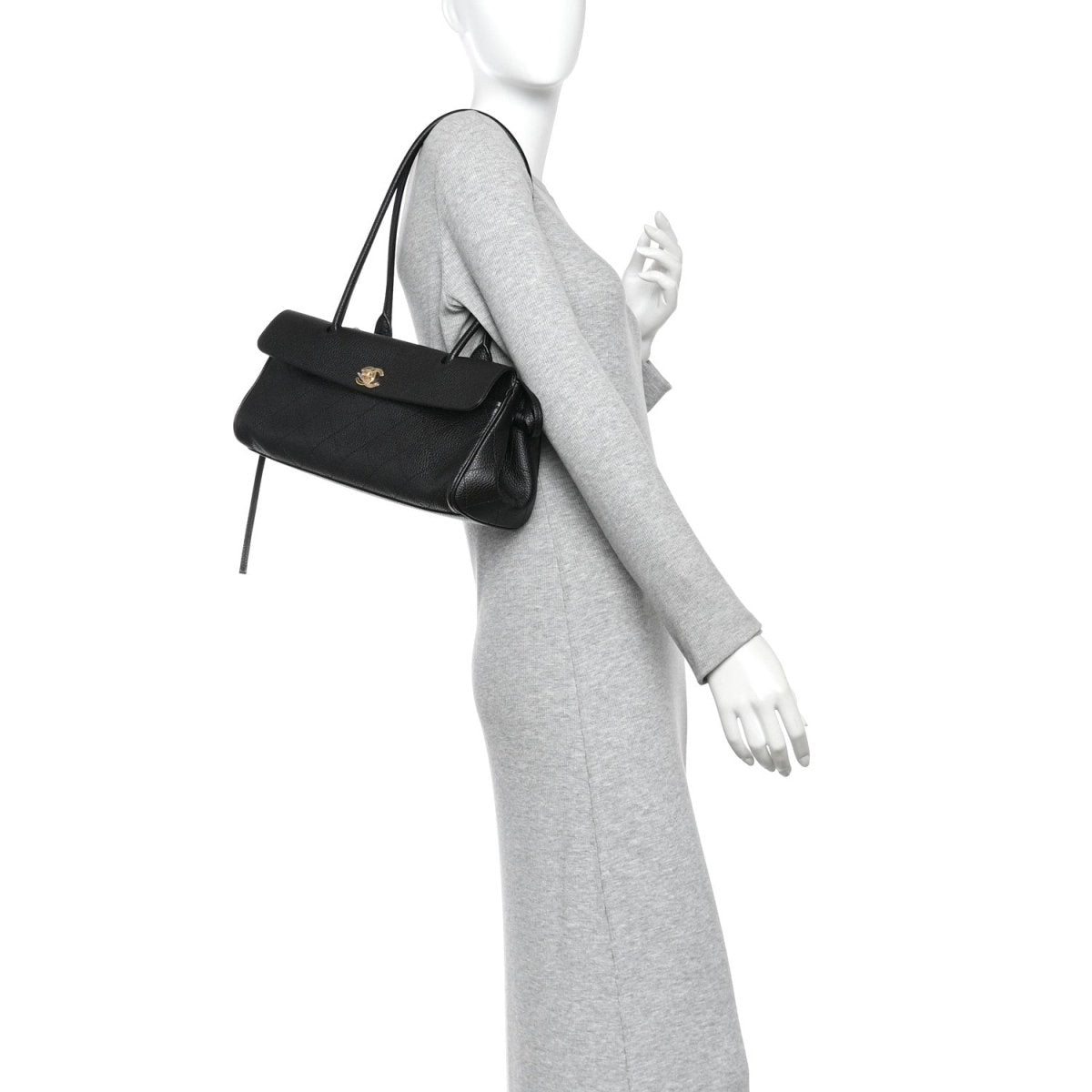 Black small shopping bag worn crossbody style, with top handle and front CC emblem
