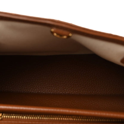 Small shopping bag interior with visible zipper track and leather lining.