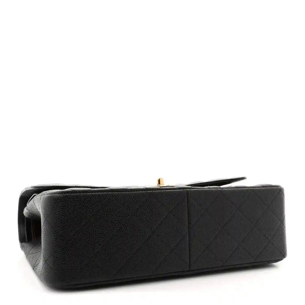 Chanel double flap bag side view in black quilted leather with gold clasp