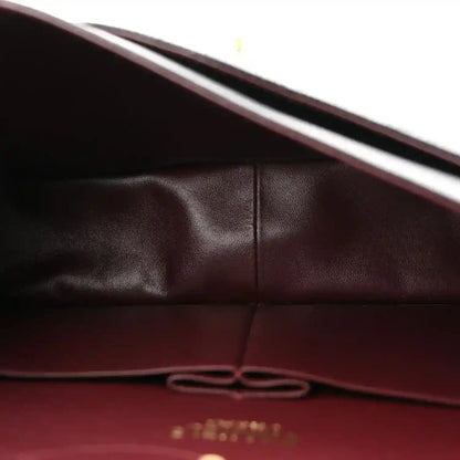 Chanel double flap bag interior lining with stitched seam and leather panel