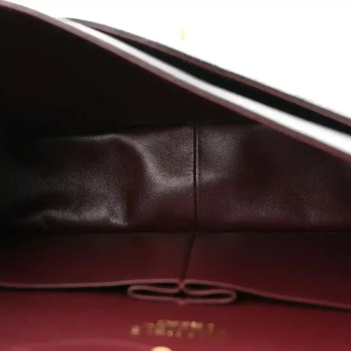 Chanel double flap bag interior lining with stitched seam and leather panel