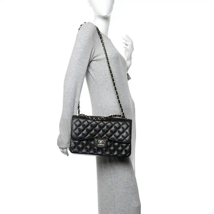 Chanel mini double flap bag in black quilted caviar leather with chain strap