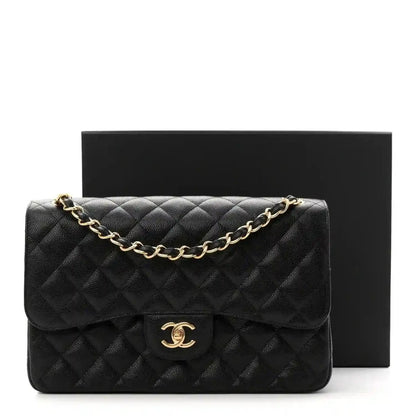 Chanel jumbo double flap bag in black quilted caviar leather, gold chain and CC clasp