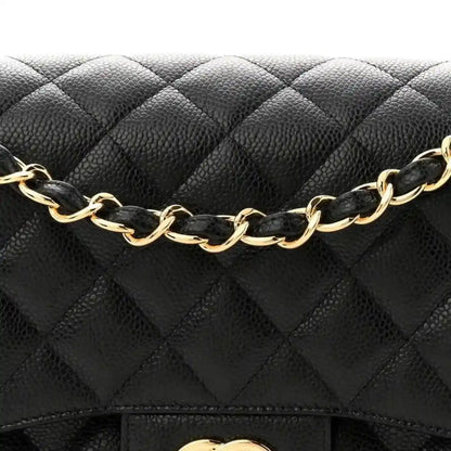 Chanel double flap bag front with black quilted caviar and gold chain