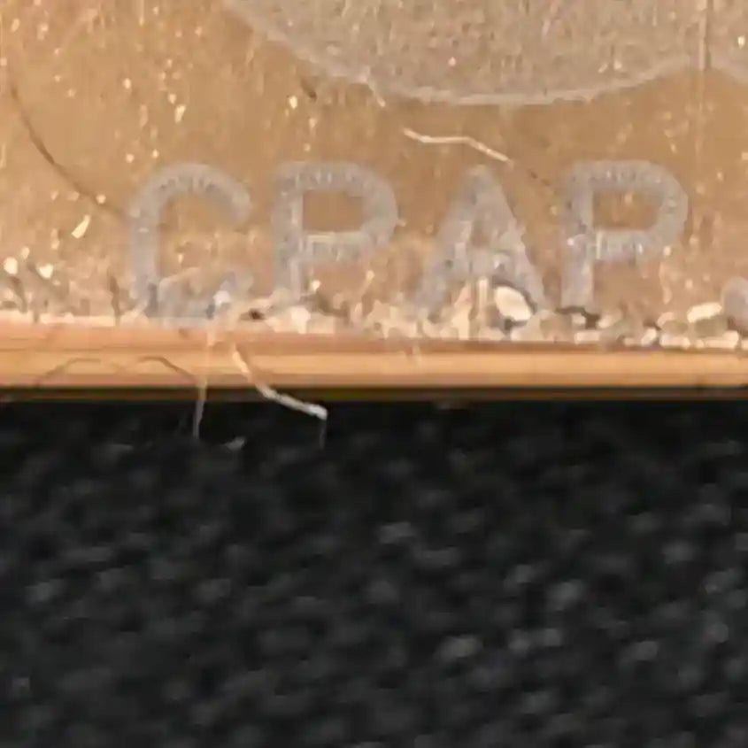 Text detail on handbag surface