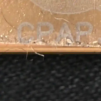 Text detail on handbag surface