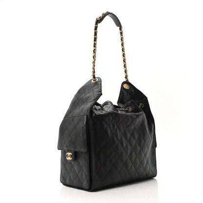 Black quilted leather bucket-style handbag with gold chain shoulder strap