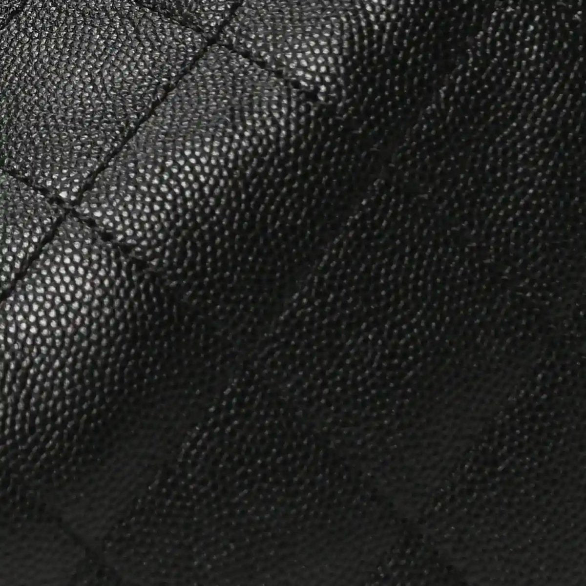 Black caviar-grain leather quilting on handbag