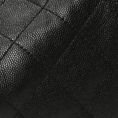 Black caviar-grain leather quilting on handbag