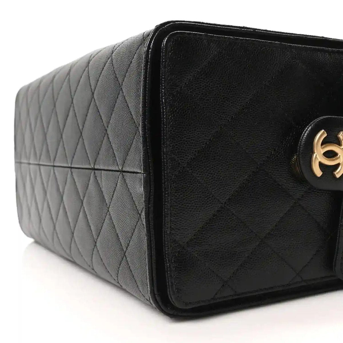 Black quilted caviar leather handbag with gold logo and flap