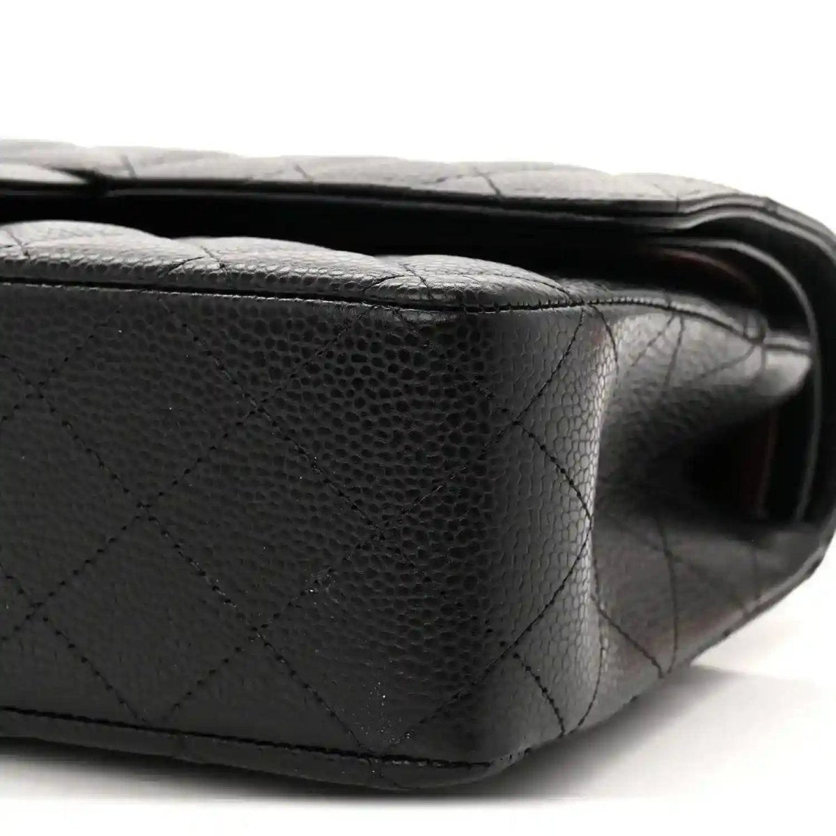 Black quilted caviar leather flap bag with smooth edge stitching detail