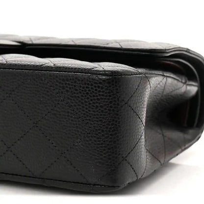 Black quilted caviar leather flap bag with smooth edge stitching detail