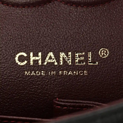 CHANEL made in France stamp on dark leather flap bag interior
