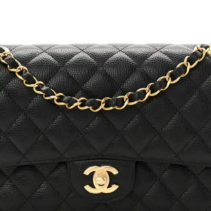 Black quilted caviar leather flap with gold chain and Chanel-style logo