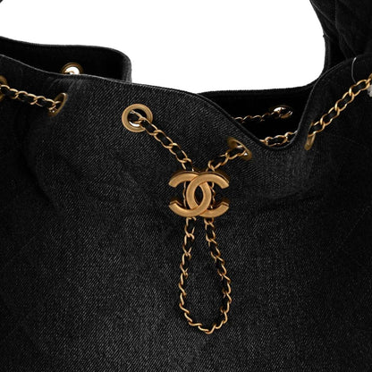 Chanel denim shoulder bag top with gold chain and CC drop charm