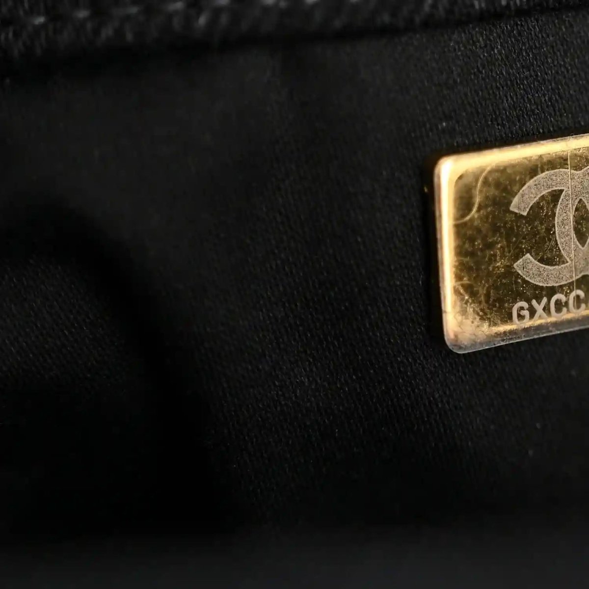 Chanel denim shoulder bag leather tab with gold plate and stamped code