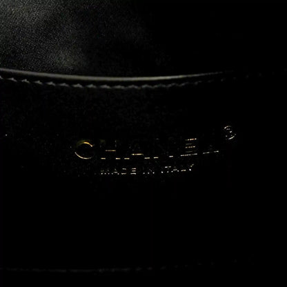 Chanel denim shoulder bag metal stamp on black fabric
