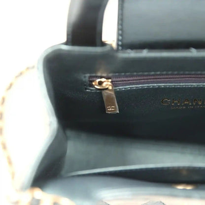 Kelly shopper interior close-up with gold zipper pull and CHANEL label