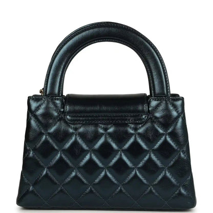 Metallic blue quilted Kelly shopper bag with flap and Chanel logo, gold hardware