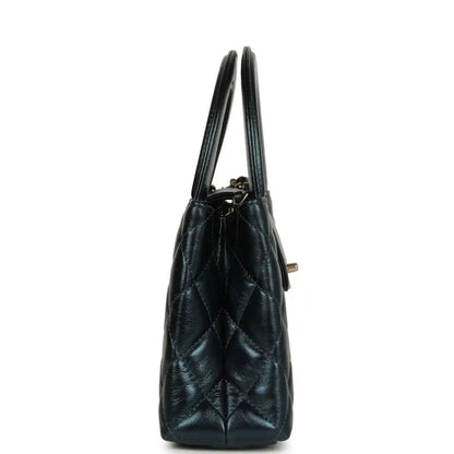 Metallic blue quilted Kelly shopper bag side view with gold-toned hardware