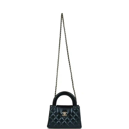 Metallic blue quilted Kelly shopper bag on a chain strap with Chanel logo