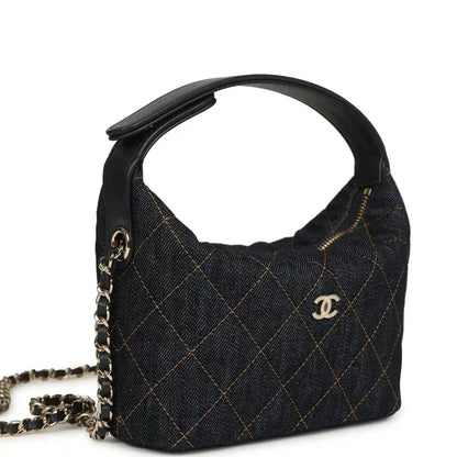 Chanel mini hobo pouch in dark blue denim with quilted pattern and gold-tone chain