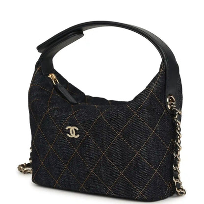 Chanel mini hobo pouch in dark blue denim with gold-tone zipper pull and logo charm