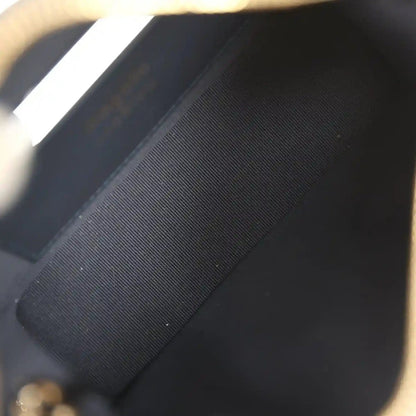 Chanel mini hobo pouch interior close-up with dark lining and stitched edge
