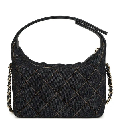 Chanel mini hobo pouch in dark blue denim with quilted diamond stitching and gold-tone links