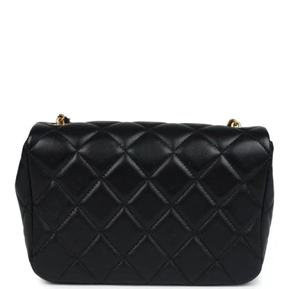 Black quilted lambskin flap bag front view with gold Chanel CC clasp hardware