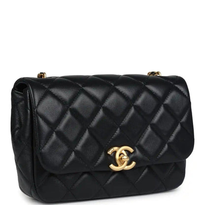 Black quilted lambskin flap bag with gold Chanel CC clasp and shoulder chain
